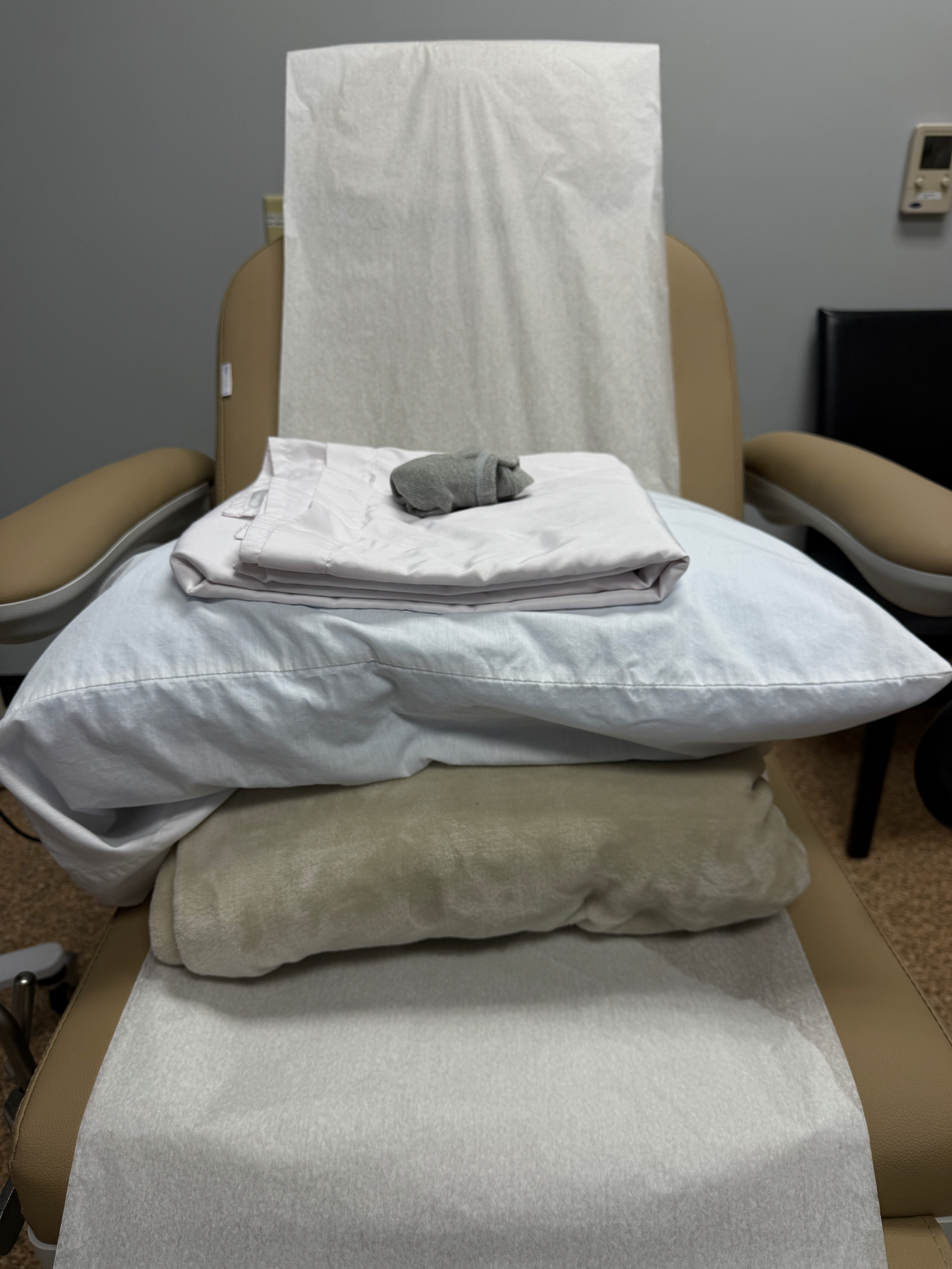 Solace_Examination_Chair Solace Center Examination Chair with pillow, gown, socks.